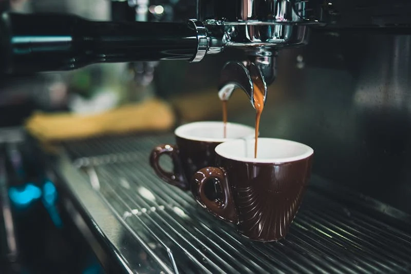 Close-up of espresso being poured from a professional machine